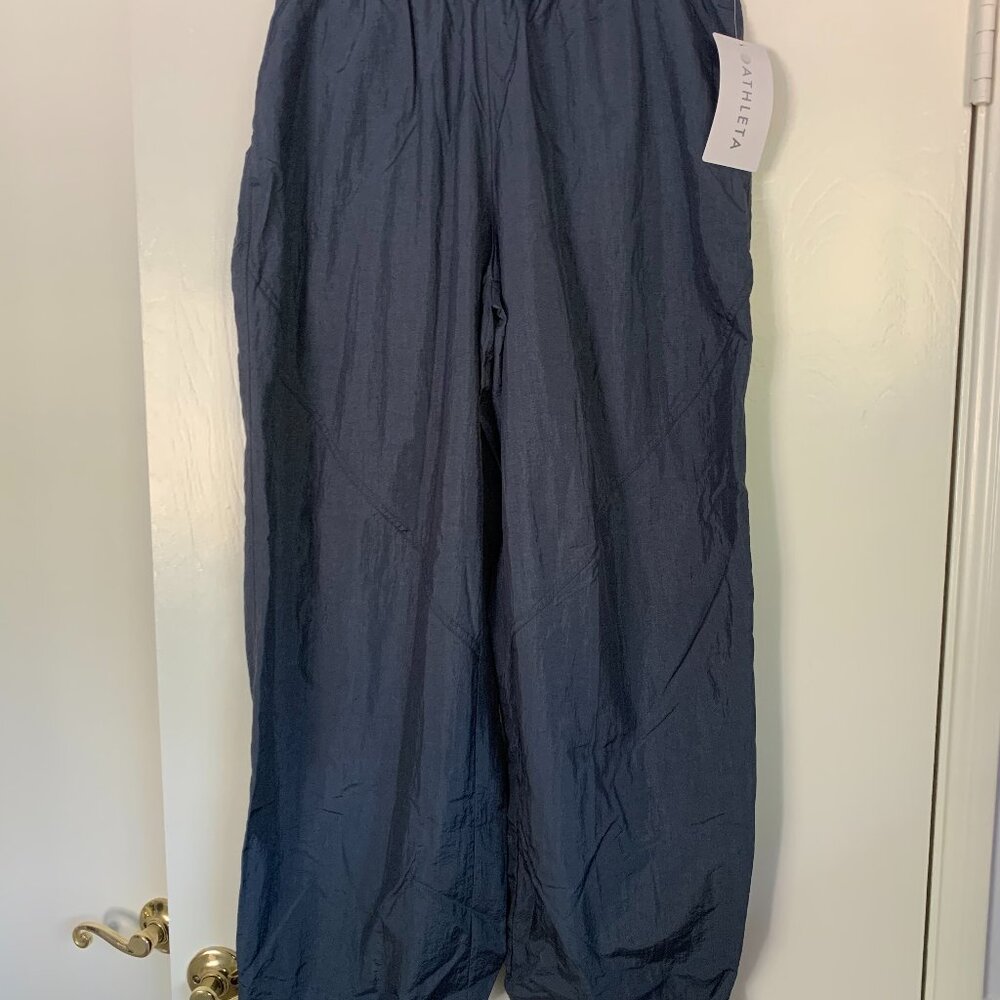 NWT Athleta Utility mid rise pant in dark rinse blue. Size large.